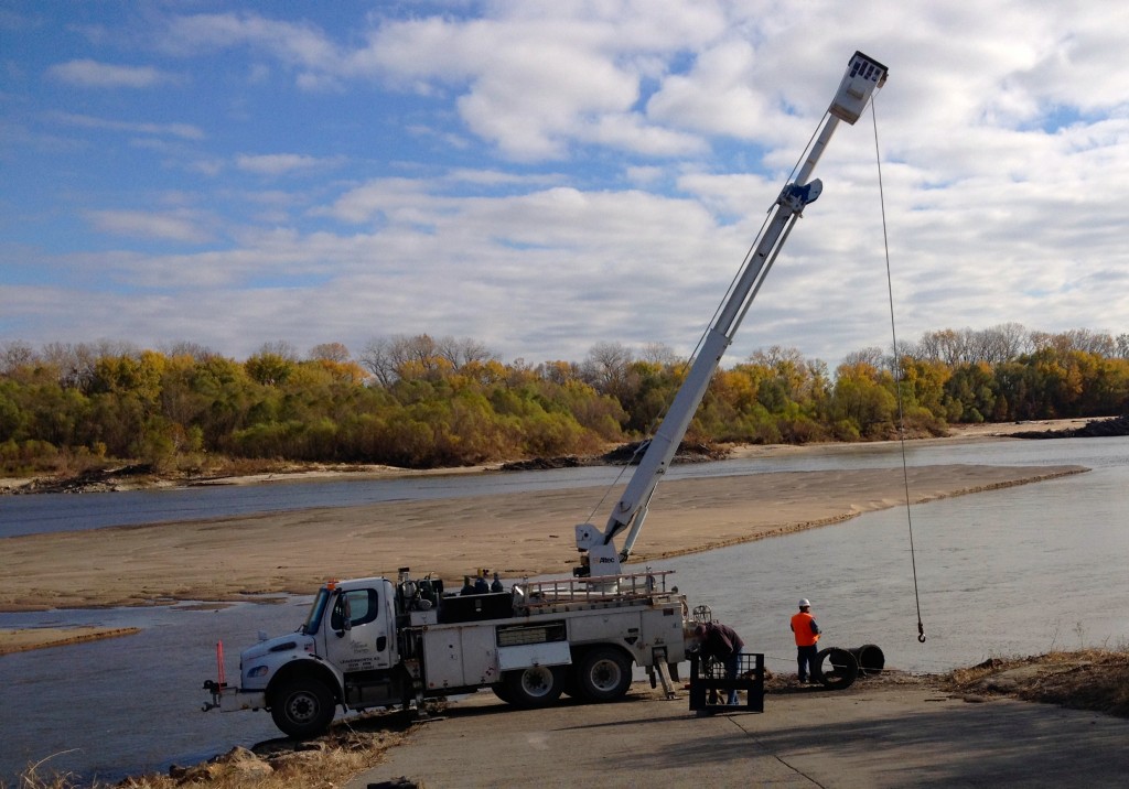 Westar's line truck pulling debris from down river!